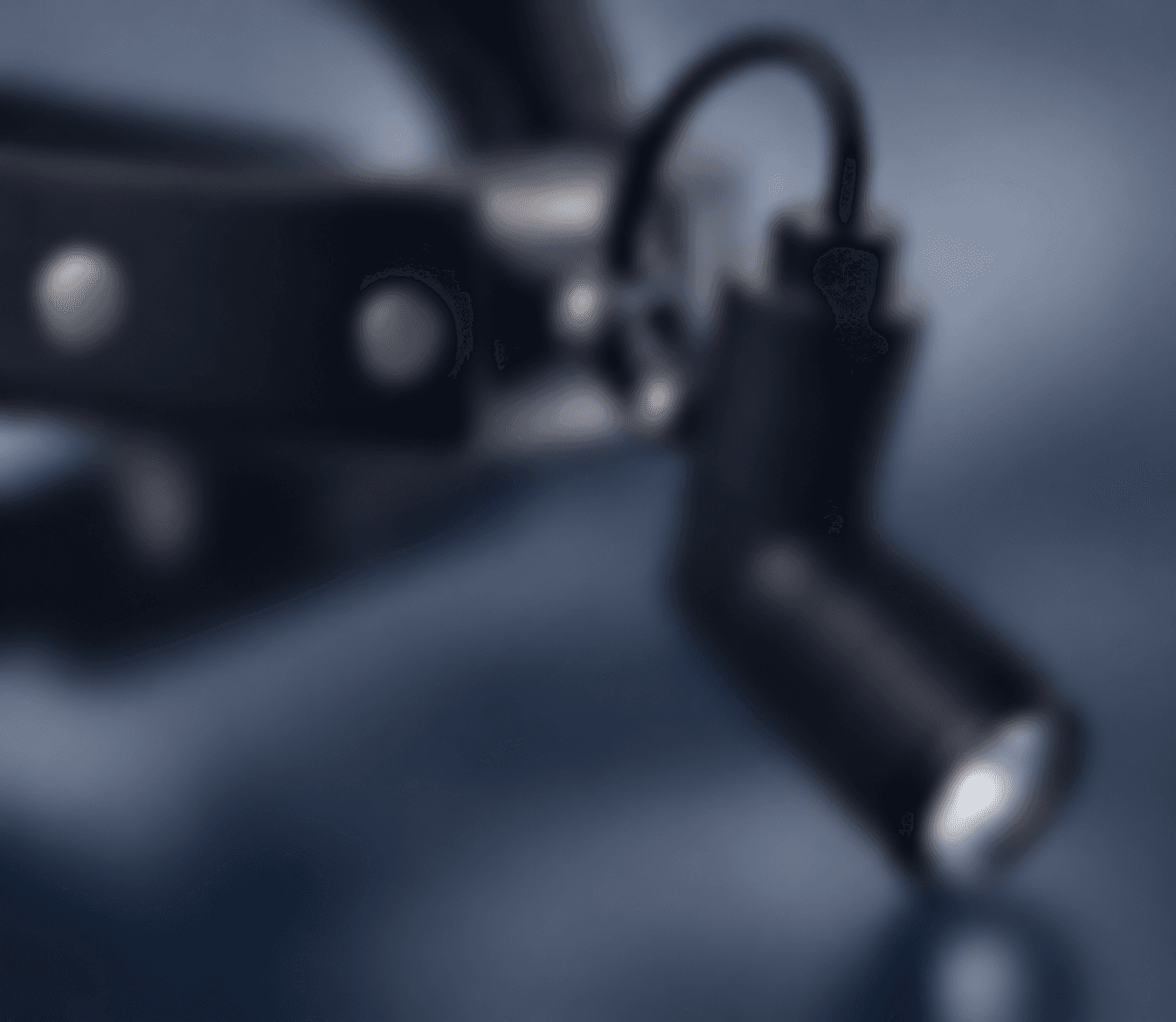 Close-up of the lamp head of an Elbnova LED medical headlight on its headband